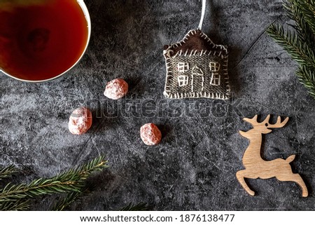 New Year's photo of cha on the table, dried kumquat, fir branches and toys, postcard