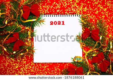 New Year 2021. Christmas greeting backgrounds. Holiday gifts and Christmas sales. The symbol of the year of the bull on a red background with elegant sparkling ornaments and snowflakes.
