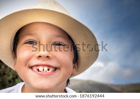 smiling boy in summer at the beach