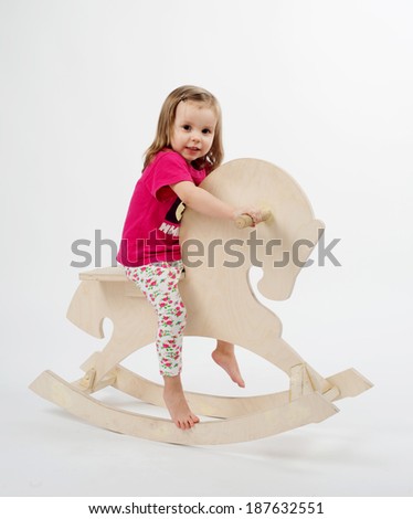girl on a wooden horse