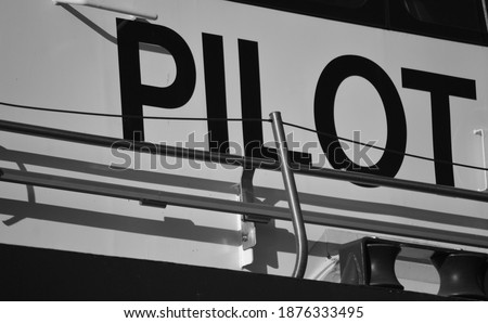 A sign reading the world pilot