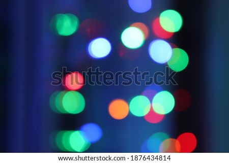 bokeh new year mood All colors green blue red yellow white blue orange On blurred Background new year Celebration garlands
