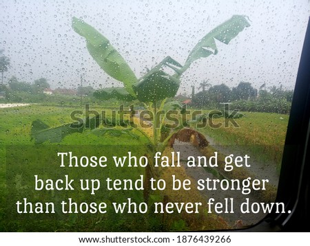 Inspirational motivational quote - Those who fall and get back up tend to be stronger than those who never fell down. On background of rain drop on mirror and banana tree growth in field on rainy day.