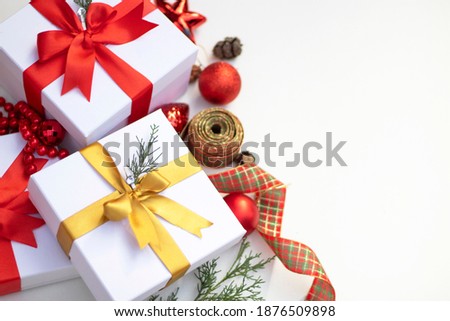 new year concept. gift boxes with ribbon , pine branches and Christmas ornaments. copy space. Christmas decorations
