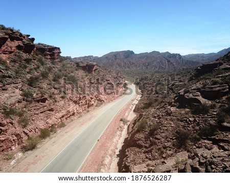 desert road in reddish mountain