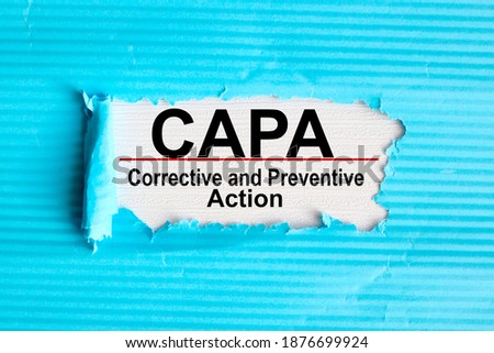Concept image of Business Acronym CAPA Corrective and Preventive action, text on white paper on notepad on white background