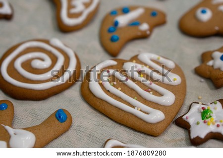 A selective focus shot of cute decorated Christmas gingerbread cookies