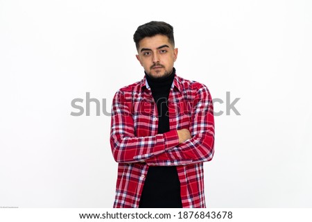 Young man wearing a checkered red shirt. Isolated White background.
