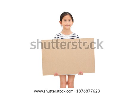 Pretty asian little child girl holding empty brown big board for media banner isolated over white background with copy space
