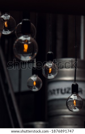 A selective focus shot of retro light bulbs hanging on wires
