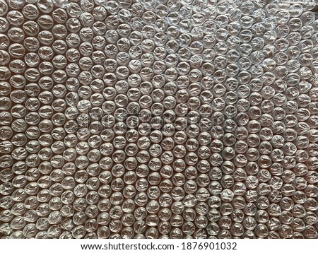 Cushion bubble wrap on dark brown background