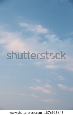 Beautiful sky background. Light blue sky with soft white clouds. Perfect for sky replacement. High quality photo