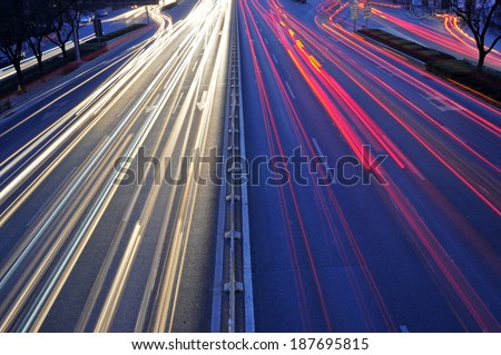 Light trails on the background of the modern architecture in Shanghai, China  Royalty-Free Stock Photo #187695815