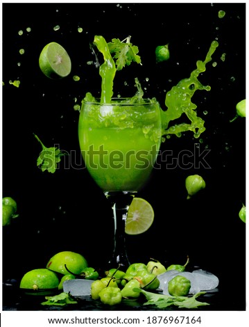 splash photography  juice with wine glass in black background 