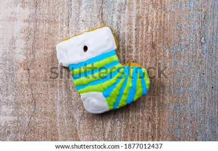 Gingerbread in the form of Christmas socks on a wooden board