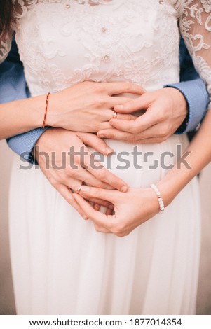 Color wedding photo, hands of husband and wife close-up, wedding ceremony