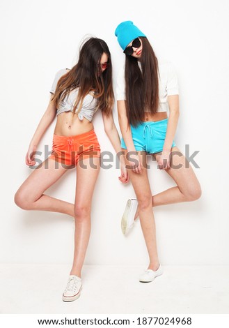 feminine cheerful teenagers female dancing having fun isolated on white background