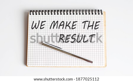 Notepad with text WE MAKE THE RESULT on a white background,Business
