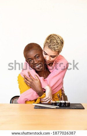 Portrait of a happy interracial homosexual couple hugging