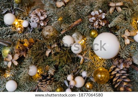 Christmas and new year tree decor with toys and balloons. Selective focus