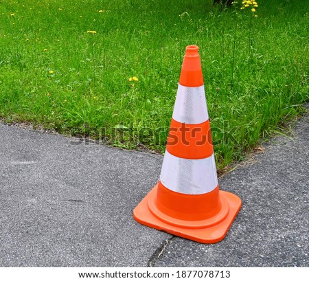 The cone on the road used warning sign.