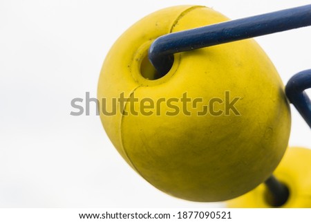 Yellow roller ball on white screen