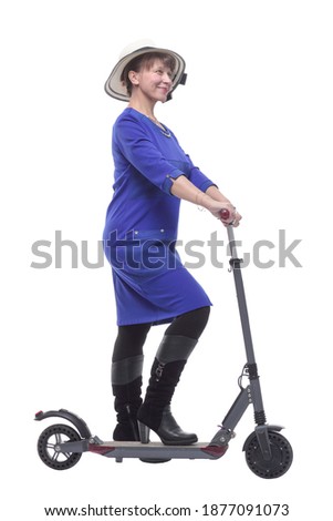 Full length profile shot of an woman with a scooter isolated on white background
