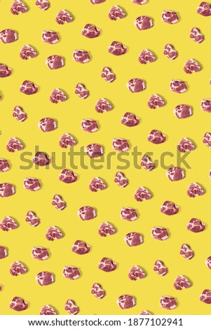 background with raw pork meat slices on yellow Illuminating background, raw food background, not pattern, poster modern creative, flatlay