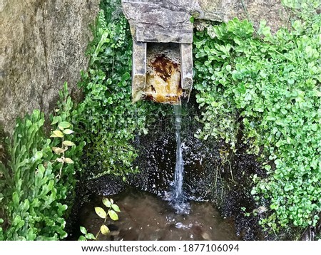 water flowing from the fountain