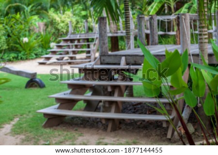 Soft focus Wooden stairs playground in the garden. Blur background for copy space.
