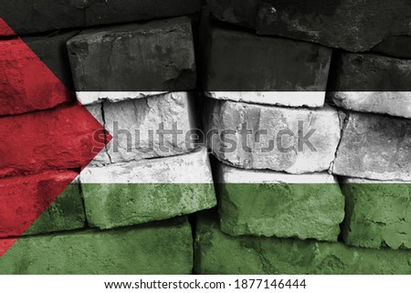 Palestine flag painted on brick wall