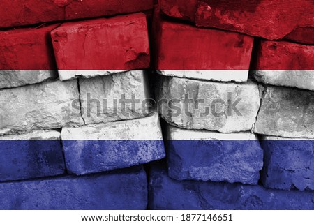 Netherlands flag painted on brick wall