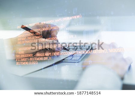 Multi exposure of abstract programming language hologram with hand writing in notepad on background with laptop, artificial intelligence and machine learning concept