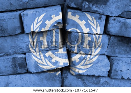 ILO flag painted on brick wall