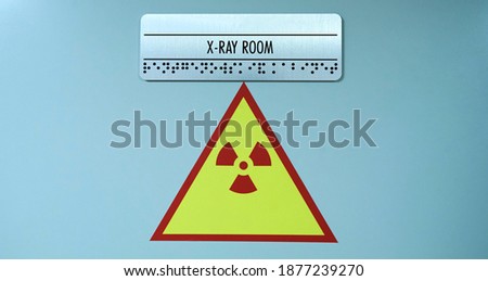 Radiation icon on the X-ray office door. Danger sign concept. Radioactive warning illustration.