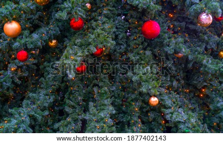 Festively decorated beautiful branches of a Christmas tree.