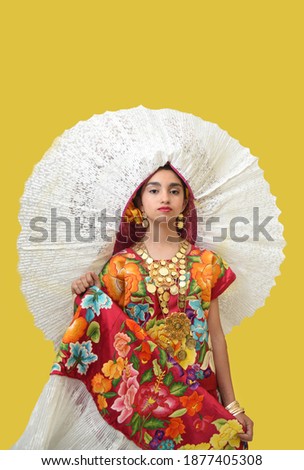 latin adolescent woman with traditional folk costume with multicolored background, dancer and mexican model posing traditional mexican clothing