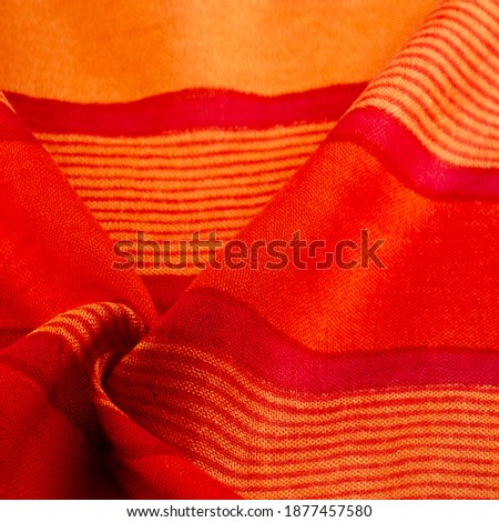Texture. Background.  fabric red-burgundy, with a print of yellow lines. wine from Burgundy fabric color