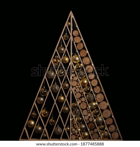 Christmas tree wooden Christmas decorative stands on a dark background