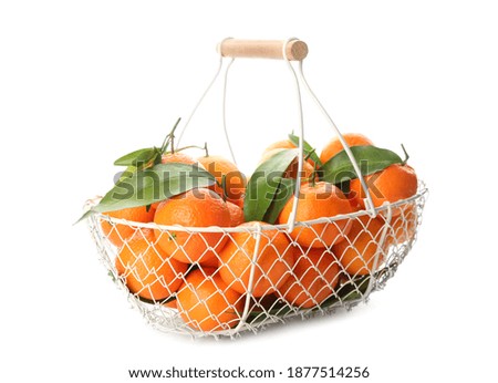 Fresh tangerines in metal basket on white background