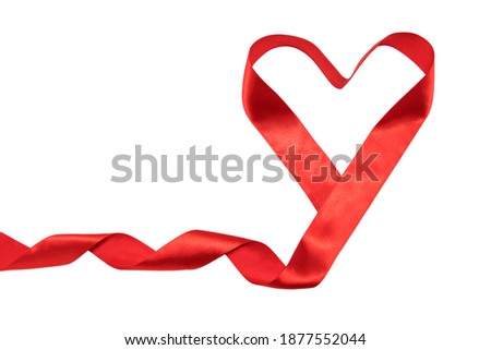 The heart of the red ribbon is isolated on a white background with room for text. Symbol of love, Valentine's Day