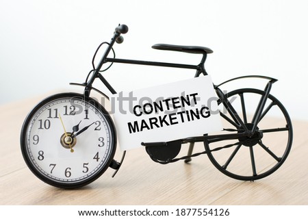 Content marketing.Content marketing card with information on watch isolated on table