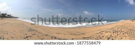 Panoramic picture of sandy beach, Panoramic of nice Beach with waves breaking and crashing with clouds in sky on the North Shore. cool beachland 