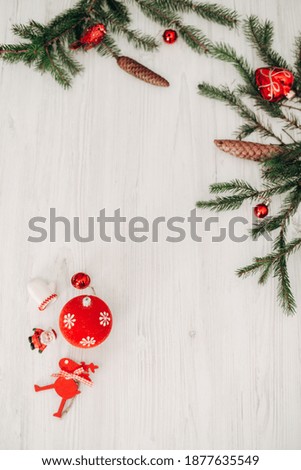 Christmas Red Decorations on a White Wooden Table with Copy Space