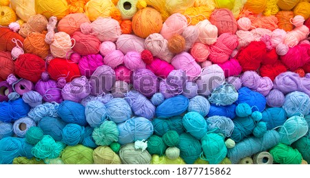 Many colorful balls of wool and cotton yarn for knitting. White background. Stretch and gradient. Rainbow layout. Royalty-Free Stock Photo #1877715862