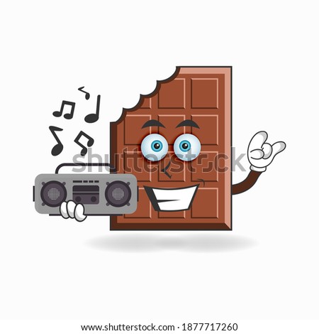 Chocolate mascot character holding a radio. vector illustration