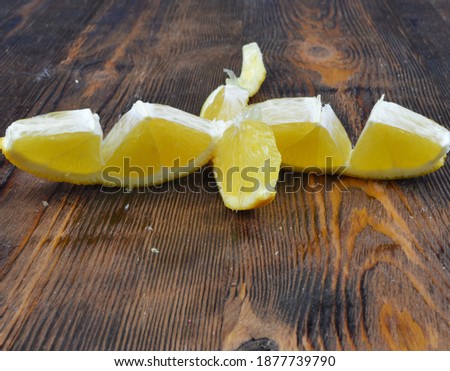 
fresh and tasty peeled orange lies on a wooden background soft focus