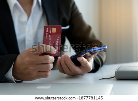 business hands holding credit card and using laptop smart phone Online shopping Website,Article, Blog.Easy Ecommerce Website Shop Online by Smartphone.Online shopping concept