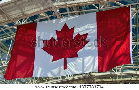 Canadian flag hanging from the stadium roof.