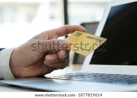 business hands holding credit card and using laptop computer for online shopping, Online payment and shopping